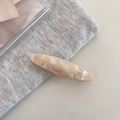 Detail view of cream marble acetate hair clip with gold Barrette la France logo lettering - 3#Creamy Apricot