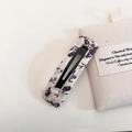 Detail of floral fabric BB clip showing vintage purple flower pattern on beige cotton - Beige Floral Square