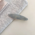 Close-up of gray-blue marble acetate hair clip with golden Barrette la France logo - 7#Fog Blue