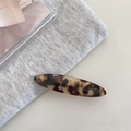 Detailed view of vintage tortoiseshell acetate hair clip with golden Barrette La France text - Leopard Print