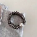 Detail of grey pleated satin hair tie with a large white pearl bead on soft fabric - 7# Grey Green - Pearl Scrunchie