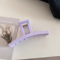 Detailed close-up of a large lavender acrylic hair claw clip with glossy finish and spring - Bar Style / Creamy Purple