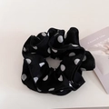 Dettaglio ravvicinato dell'elastico a pois con trama a balze in chiffon a strati - Nero
