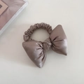 Detail view of a taupe satin bow scrunchie with elegant silk texture and elastic band - Ice Berry Pink