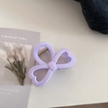 Detailed view of the lavender clover hair claw clip with heart cutouts and metal spring - Heart Bow Style / Creamy Purple
