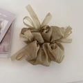 Detail of khaki pleated tulle scrunchie with soft mesh bow design and elegant texture - Olive Green