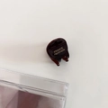 Detailed macro view of small acetate hair claw clip with golden France Handmade lettering - Dark Coffee