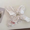 Close-up of white scrunchie with colorful polka dots and Honeycolor brand label - Colorful Polka Dots (Square Scarf Style)