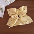 Detail of yellow checkered scrunchie with red cherry prints and a delicate bow detail - Yellow Bowknot Style