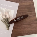 Close-up of vintage brown acetate hair clip with sparkling flower rhinestone patterns - Dark Coffee