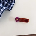 Close-up of tortoise shell resin hair clip with purple flower and amber rhinestone detail - Purple Flower with Red Base