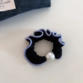 Detail view of black scrunchie with blue striped edge and a large decorative pearl - Blue Striped (5830689349526)