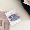 Detailed macro view of two marbled purple and blue acetate oval hair clips on a card - 6# Blue-Pink Gradient