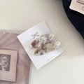 Detail showing two oval marble pattern acetate hair clips on a white display card - 7# Gradient Latte