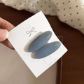 Close-up of Morandi blue oval hair clips with gold Handmade lettering and white display card - 2# Blue