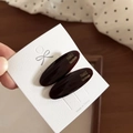 Detail of tortoise shell acetate hair clips on a premium white textured display card - Dark Coffee