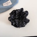 Close-up of navy floral scrunchie with white patterns and delicate pearl bead detail - Black Paisley