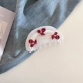 Detail of pearlescent acetate hair claw with red cherry accents and tiny rhinestones - Cherry Acetate Semicircle Hair Claw / Mermaid White