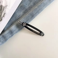 Detail of black acetate oval hair clip with colorful rhinestones on denim background - 9# Black