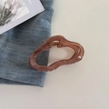 Close-up of a large brown translucent cloud-shaped hair claw clip with golden metal spring - Gradient Coffee