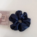 Close-up of navy blue satin scrunchie with elegant pleated texture and silky finish - Dark Blue