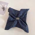Detailed shot of navy blue plaid fabric hair accessory with a minimalist logo tag - Square Scarf Scrunchie / Navy Plaid