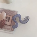 Detail view of a translucent Morandi blue wave-shaped hair claw clip on a white surface - 1# Gray