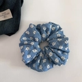 Detail of blue denim fabric scrunchie featuring white daisy floral embroidery textures - Large Hoop / Light Blue Floral