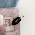 Detailed macro view of black acetate hair clip with golden France Handmade lettering - Black