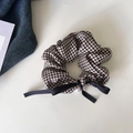 Close-up of houndstooth hair scrunchie with silk bow and faux pearl pendant detail - Coffee Grid Bow Scrunchie
