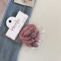 Close-up of elastic pink hair ties with matte heart and square beads on packaging - 3 Pieces Set / Deep Pink