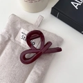Elegant deep red infinity knot hair claw clip on a minimalist cream fabric background - Medium Y-Knot Style