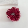 Detail of dark red satin scrunchie with elegant red and white checkered ribbon edge - Red