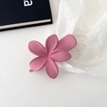 Detail view of the pink flower hair clip with a soft matte texture and 3D floral design - Rose Pink