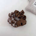 Close-up of brown silk and houndstooth pattern scrunchie hair tie on white background - Coffee Plaid Patchwork