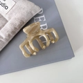 Detail showing the France Handmade engraving on the marble effect acetate claw clip - Beige