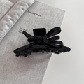 Elegant black glossy acetate ribbon bow hair claw clip for a sophisticated updo hairstyle - Black