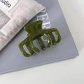 Detailed close-up of olive green acetate hair claw showing France Handmade engraving - 3# Green