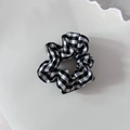 Detailed view of a vintage black and white gingham scrunchie with soft fabric texture - Medium Plaid (Small Size)
