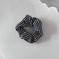 Macro detail of black and white houndstooth fabric scrunchie with elegant pleats - Houndstooth (Small Size)