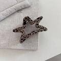 Detailed view of leopard print star hair claw clip with glossy finish and metal spring - Star Style