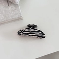 Large zebra pattern hair claw clip with black and white abstract design in glossy finish - Semicircle Style