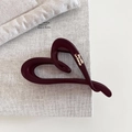 Detail of matte burgundy heart hair claw with golden Barrette La France lettering - Red Heart