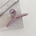 Close-up of matte Morandi pink hair claw clip with golden Barrette La France lettering - Crossed / Pink Cross