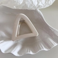 Minimalist cream geometric triangle hair claw clip resting on a white shell tray - Small Triangle Shape - White