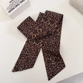 Close-up of leopard print satin hair scarf featuring a smooth glossy silk-like texture - Leopard Print Scarf