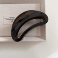 Macro detail of a dark translucent resin crescent hair claw clip on beige fabric - 7# Black Gray