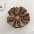 Detail view of the coffee brown pleated fabric scrunchie with fine edge stitching texture - Khaki