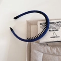 Detail view of the navy blue knitted headband showing the non-slip inner teeth and texture - Dark Blue