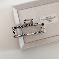 Detail of zebra pattern fabric wrapped hair claw clip on a minimalist display tray - White Zebra Pattern Square Style